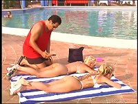 Two horny blondes share a wang o the poolside in FFM clip